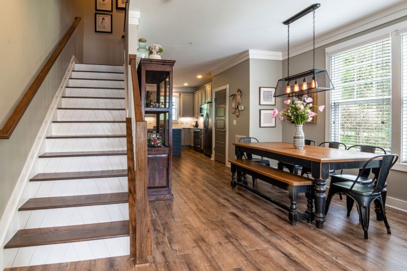Sympli Mortgage of North Carolina 22 Bright and inviting dining area features a wooden table stai 1784048529
